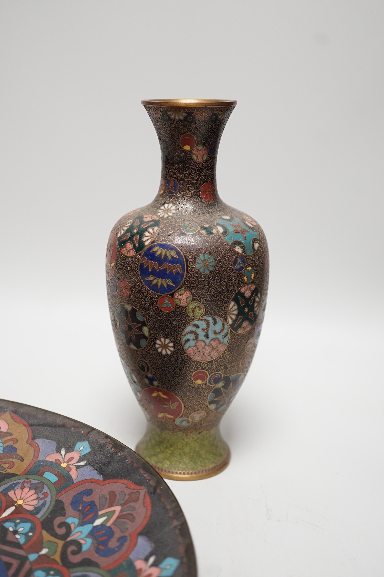 A Japanese cloisonné enamel dish, 30.5cm diameter and a pair of Japanese cloisonné enamel vases. (3)